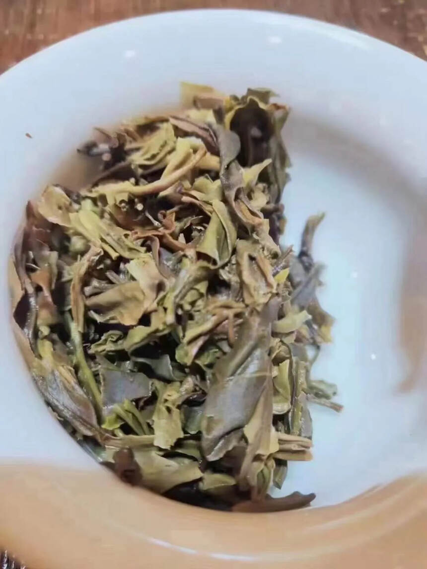 勐海乔木生态茶，七星孔雀，357克一饼，汤色透亮，冰
